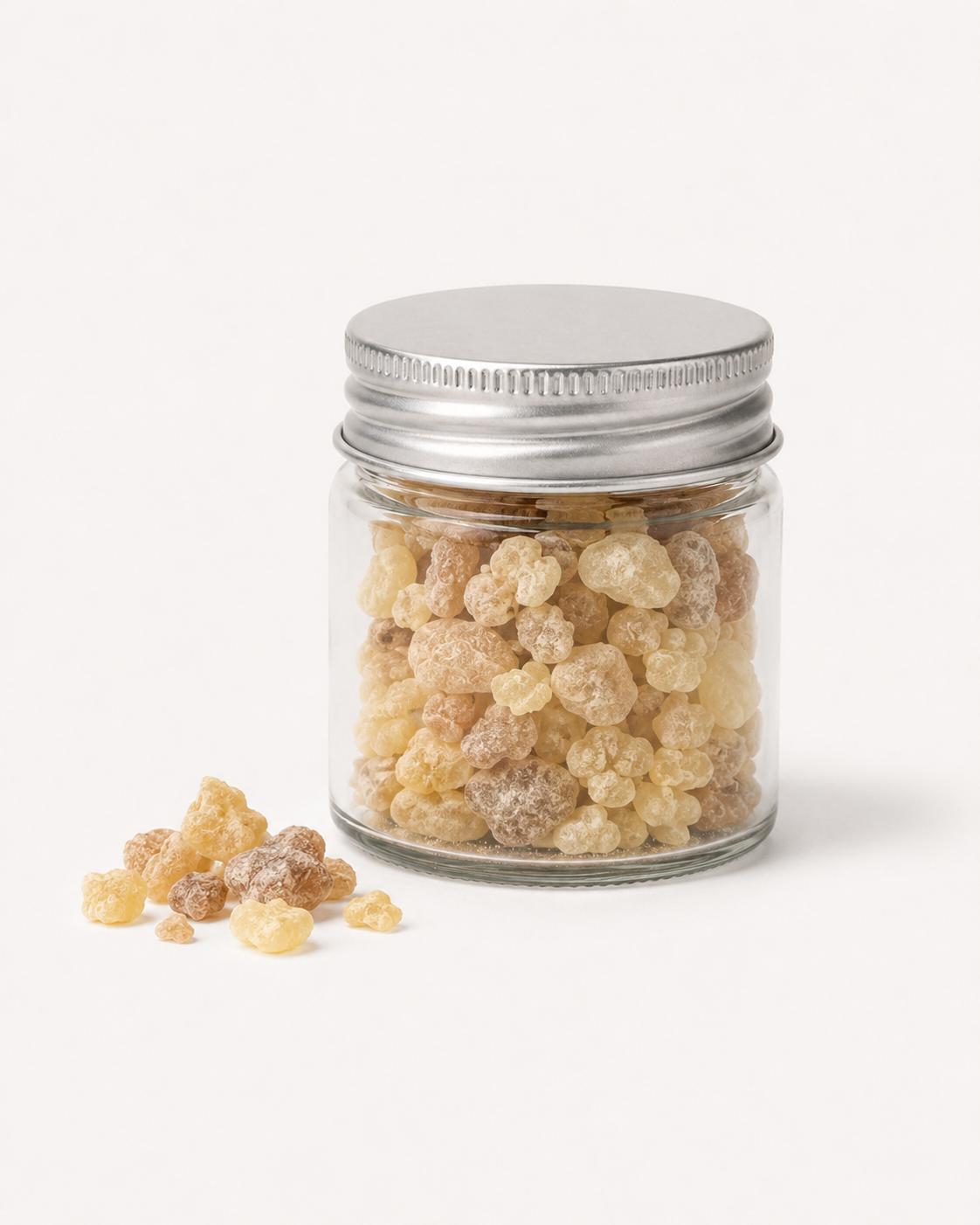 Closed jar of Maydi with loose resin pieces beside it